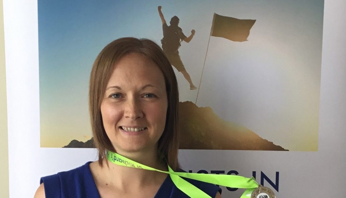Claudine with her medal