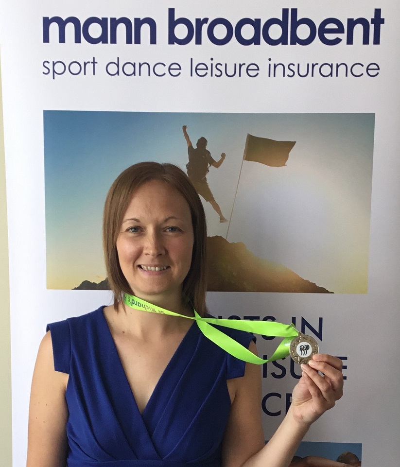 Claudine with her medal